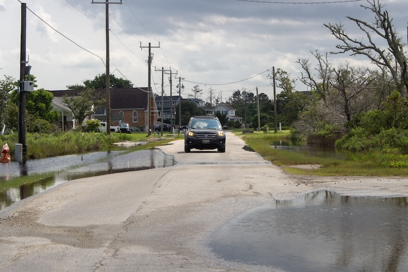 Car Driving Through Flood
